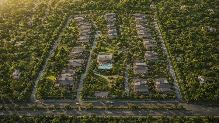 Godrej Soukya Road full top-down aerial of the 20-acre campus with central clubhouse and pool Godrej Soukya Road full top-down aerial of the 20-acre campus with central clubhouse and pool